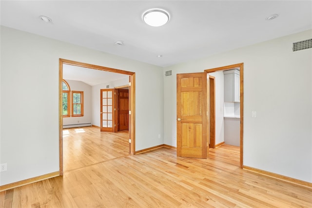 521 Plattekill Ardonia Rd, Wallkill, NY 12589 - empty room with a baseboard heating unit, light wood-type flooring, baseboards, and a smoke detector