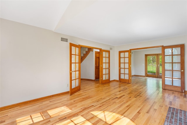 521 Plattekill Ardonia Rd, Wallkill, NY 12589 - unfurnished room with french doors, light wood-style floors, and baseboards