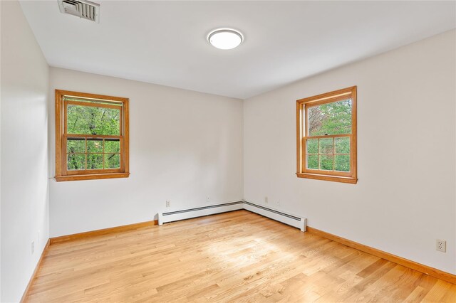 521 Plattekill Ardonia Rd, Wallkill, NY 12589 - empty room with a baseboard radiator, wood finished floors, and baseboards