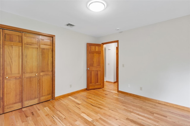 521 Plattekill Ardonia Rd, Wallkill, NY 12589 - unfurnished bedroom with light wood-style floors, baseboards, and a closet