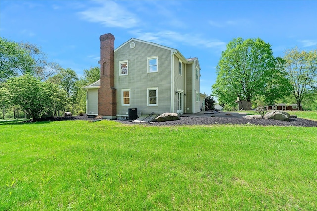 521 Plattekill Ardonia Rd, Wallkill, NY 12589 - back of house featuring a yard, central AC, and a chimney