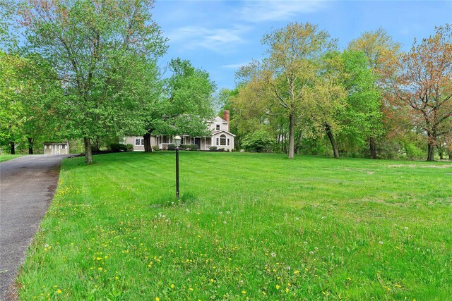 521 Plattekill Ardonia Rd, Wallkill, NY 12589 - view of green lawn featuring driveway and an outdoor structure