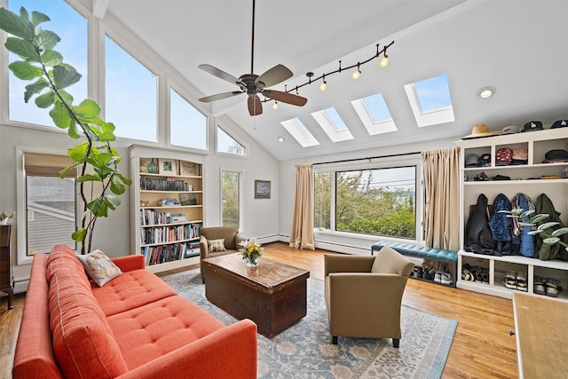 8 Wolf Rd, Croton-On-Hudson, NY 10520 - living room with a skylight, a ceiling fan, wood finished floors, high vaulted ceiling, and track lighting
