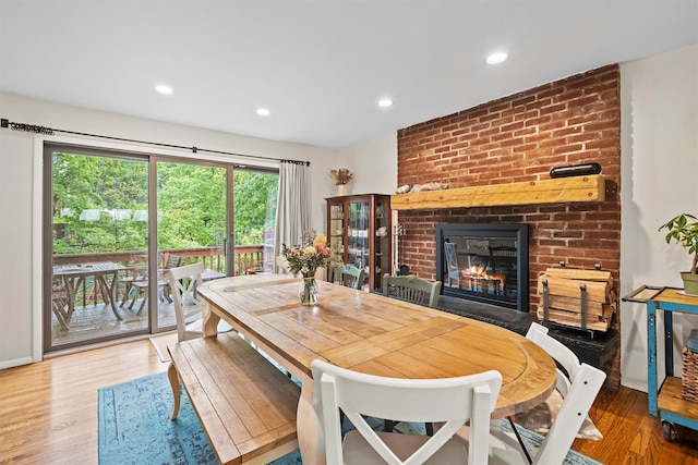 8 Wolf Rd, Croton-On-Hudson, NY 10520 - dining space featuring a fireplace, wood finished floors, and recessed lighting
