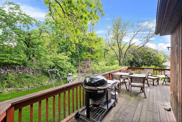 8 Wolf Rd, Croton-On-Hudson, NY 10520 - deck with a grill, a lawn, and outdoor dining area