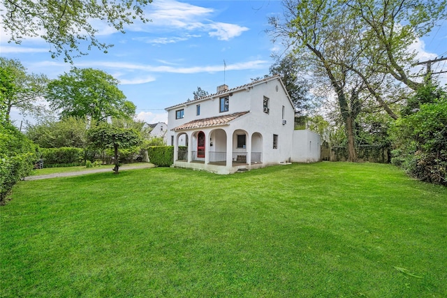 130 Columbus Ave, Port Chester, NY 10573 - view of front facade featuring a tile roof and stucco siding