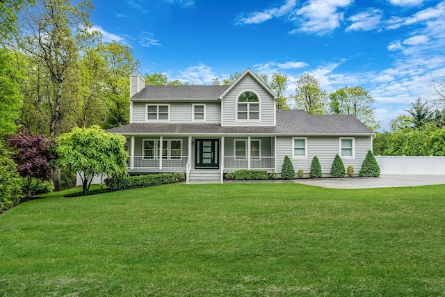 56 N Woods Rd, Baiting Hollow, NY 11933 - view of front of home with a chimney, roof with shingles, a front yard, and a porch
