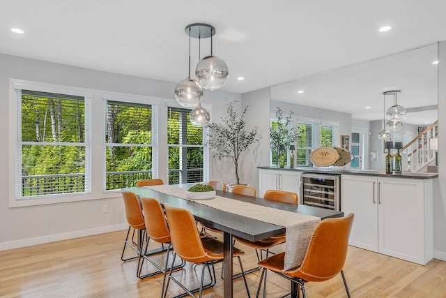 56 N Woods Rd, Baiting Hollow, NY 11933 - dining area with wine cooler, baseboards, light wood finished floors, and recessed lighting