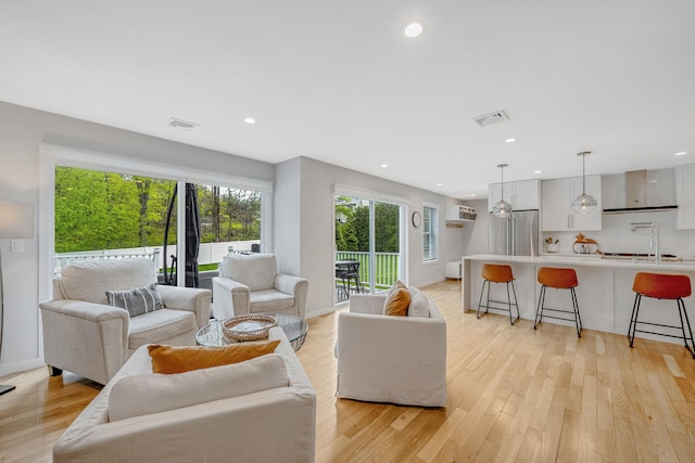 56 N Woods Rd, Baiting Hollow, NY 11933 - living area featuring light wood finished floors and recessed lighting