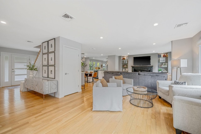 56 N Woods Rd, Baiting Hollow, NY 11933 - living area with light wood-style flooring, stairway, and recessed lighting