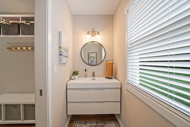 56 N Woods Rd, Baiting Hollow, NY 11933 - bathroom featuring wood finished floors, baseboards, and vanity