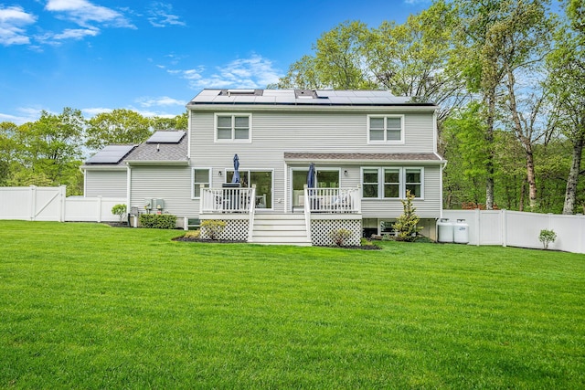 56 N Woods Rd, Baiting Hollow, NY 11933 - rear view of property featuring a deck and solar panels