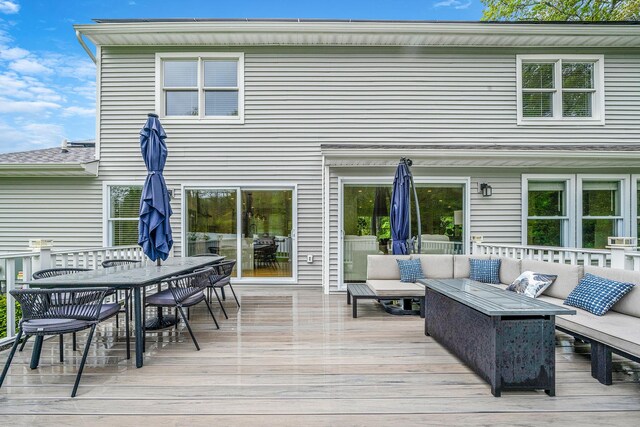 56 N Woods Rd, Baiting Hollow, NY 11933 - wooden deck with an outdoor hangout area and outdoor dining space