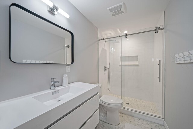56 N Woods Rd, Baiting Hollow, NY 11933 - bathroom featuring speckle patterned floor, toilet, a stall shower, and vanity