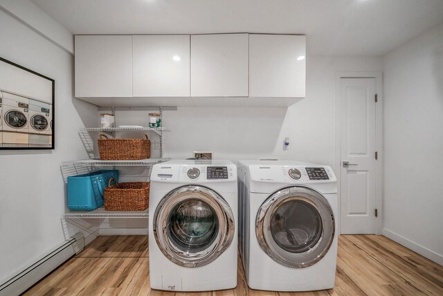 56 N Woods Rd, Baiting Hollow, NY 11933 - clothes washing area with baseboard heating, washing machine and clothes dryer, light wood finished floors, and baseboards