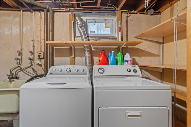 laundry area with laundry area and washer and clothes dryer