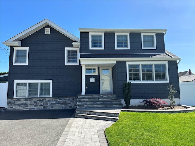 view of front of home with a front lawn
