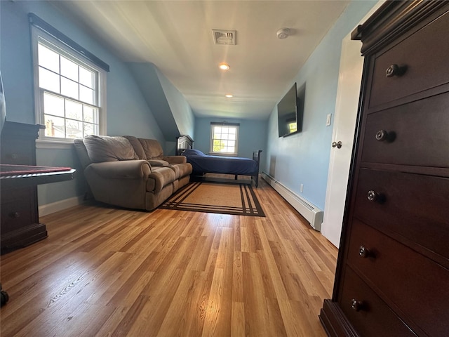 living room featuring a baseboard radiator, recessed lighting, baseboards, visible vents, and light wood-type flooring
