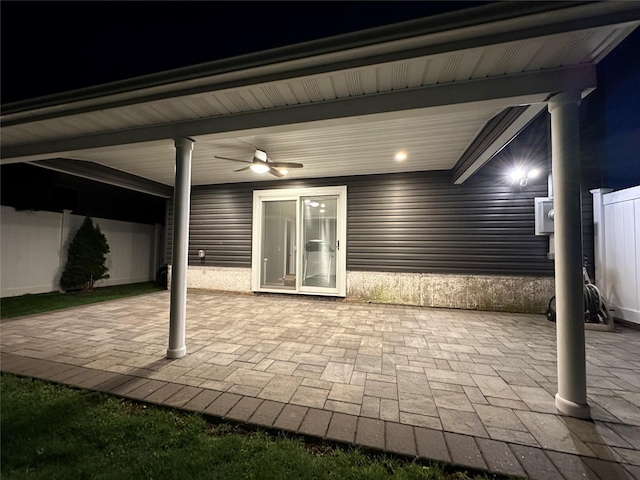 patio at night with a ceiling fan