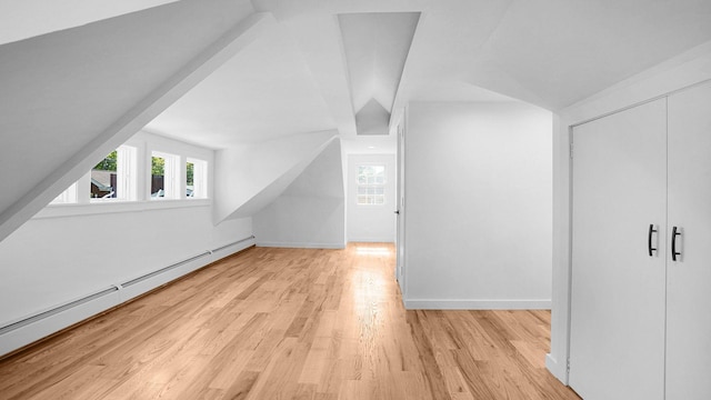2227 Boller Ave, Bronx, NY 10475 - additional living space with a baseboard heating unit, light wood finished floors, and baseboards