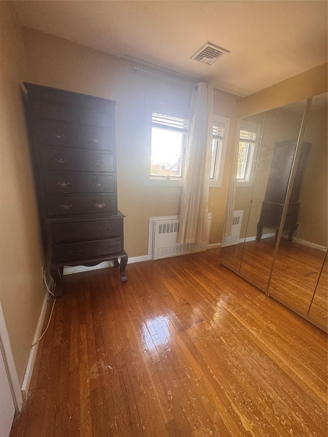 1001 Van Buren St, Baldwin, NY 11510 - unfurnished bedroom featuring hardwood / wood-style floors and baseboards