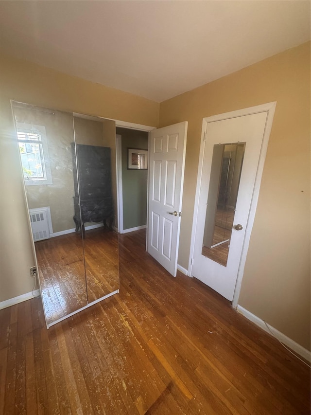 1001 Van Buren St, Baldwin, NY 11510 - unfurnished bedroom with wood-type flooring and baseboards