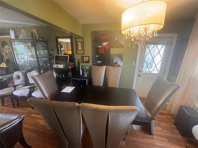 1001 Van Buren St, Baldwin, NY 11510 - dining space featuring a chandelier and wood finished floors