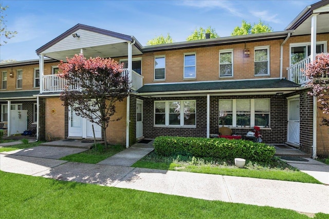 152 Artist Lake Dr Unit 152, Middle Island, NY 11953 - view of property with brick siding and a balcony