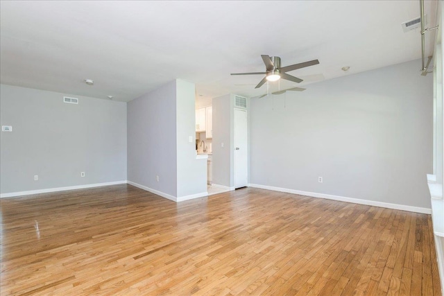 152 Artist Lake Dr Unit 152, Middle Island, NY 11953 - unfurnished room featuring light wood-type flooring, a ceiling fan, baseboards, and a sink