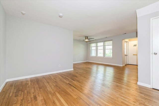 152 Artist Lake Dr Unit 152, Middle Island, NY 11953 - spare room with light wood-style flooring, ceiling fan, baseboards, and a smoke detector