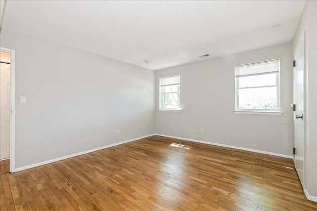 152 Artist Lake Dr Unit 152, Middle Island, NY 11953 - spare room with wood finished floors and baseboards
