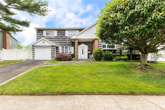 402 Spangle Dr, North Babylon, NY 11703 - view of front facade featuring asphalt driveway and a garage
