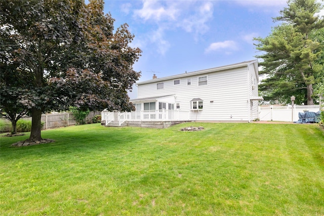 402 Spangle Dr, North Babylon, NY 11703 - back of property featuring a deck and a chimney