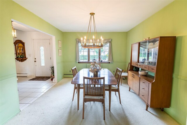 402 Spangle Dr, North Babylon, NY 11703 - dining area featuring baseboard heating, a chandelier, light carpet, and light tile patterned floors