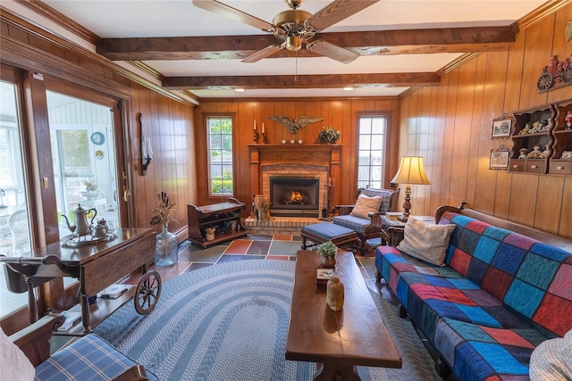 402 Spangle Dr, North Babylon, NY 11703 - living area with beamed ceiling, wood walls, a brick fireplace, and a ceiling fan