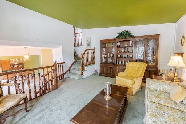 402 Spangle Dr, North Babylon, NY 11703 - carpeted living room with a chandelier and stairway