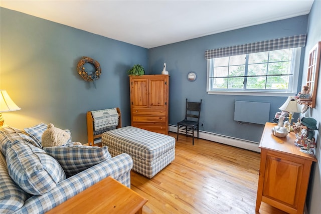 402 Spangle Dr, North Babylon, NY 11703 - living area with a baseboard radiator and light wood finished floors