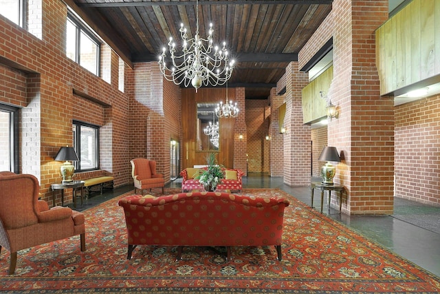 community lobby with a high ceiling, brick wall, wood ceiling, and beamed ceiling