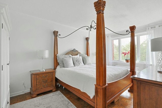 bedroom featuring baseboards