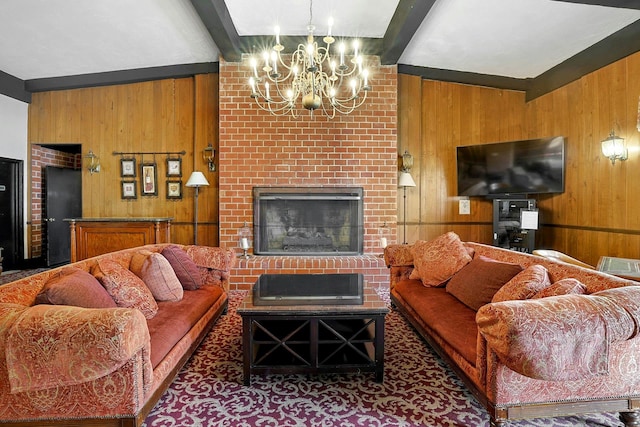 living room featuring wood walls, a chandelier, and a fireplace