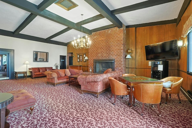 living area with a chandelier, carpet floors, beamed ceiling, wood walls, and a fireplace