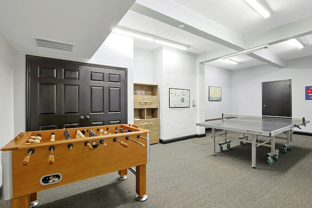 recreation room with carpet flooring and baseboards