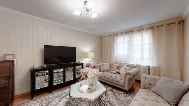 living room with ornamental molding and wood finished floors