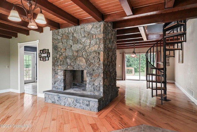346 Gifford Hollow Rd, Call Listing Agent, NY 12023 - unfurnished living room featuring stairs, wood-type flooring, plenty of natural light, baseboards, and beam ceiling