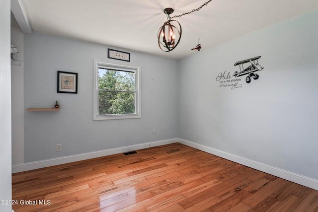 346 Gifford Hollow Rd, Call Listing Agent, NY 12023 - empty room with a chandelier, light wood-style floors, and baseboards