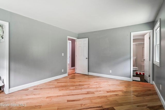 346 Gifford Hollow Rd, Call Listing Agent, NY 12023 - unfurnished bedroom featuring light wood finished floors, baseboards, and ensuite bath