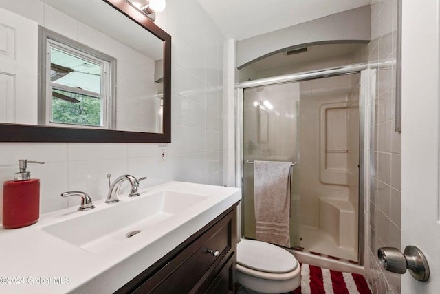 346 Gifford Hollow Rd, Call Listing Agent, NY 12023 - bathroom featuring tile walls, a shower stall, toilet, vanity, and backsplash