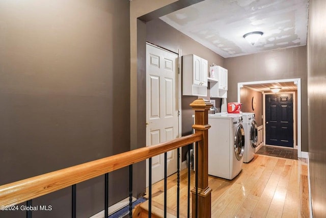 346 Gifford Hollow Rd, Call Listing Agent, NY 12023 - clothes washing area featuring cabinet space, independent washer and dryer, and light wood-type flooring