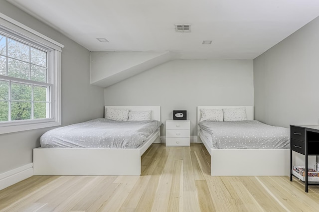 bedroom with wood finished floors