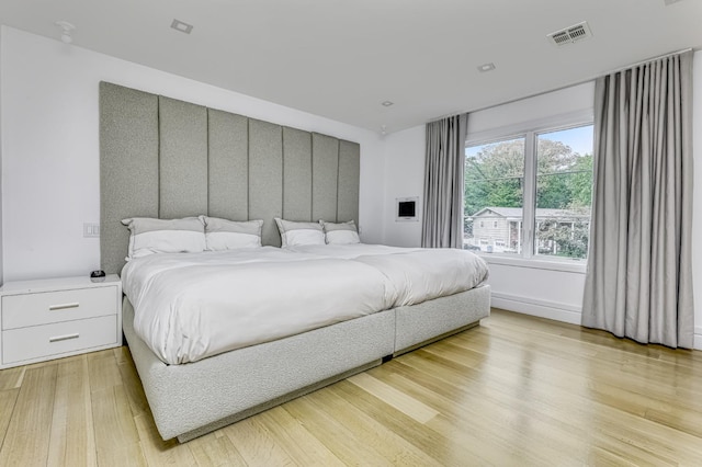 bedroom featuring light wood-type flooring